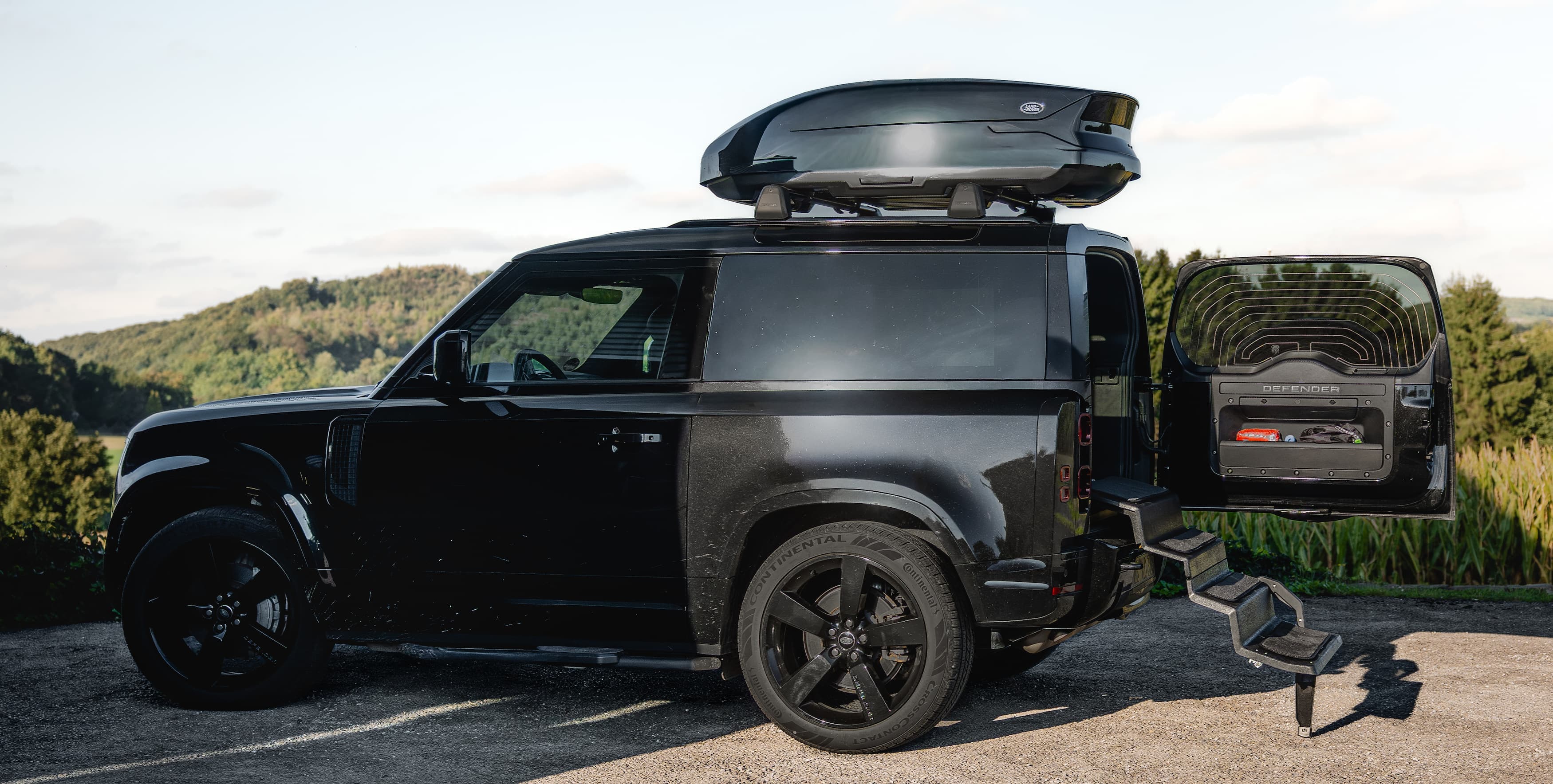Land Rover Defender 90 with Dog&Drive Dog Steps installed in the boot